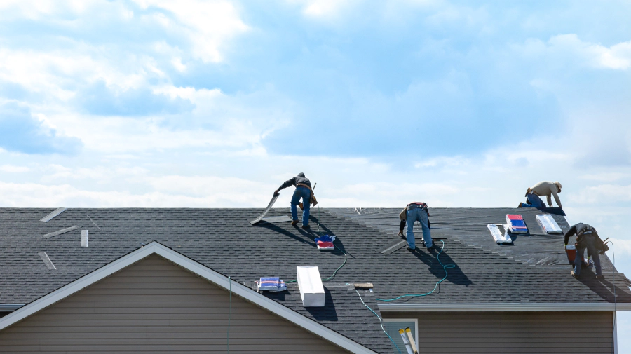 contractors installing a new asphalt shingle roof valparaiso in